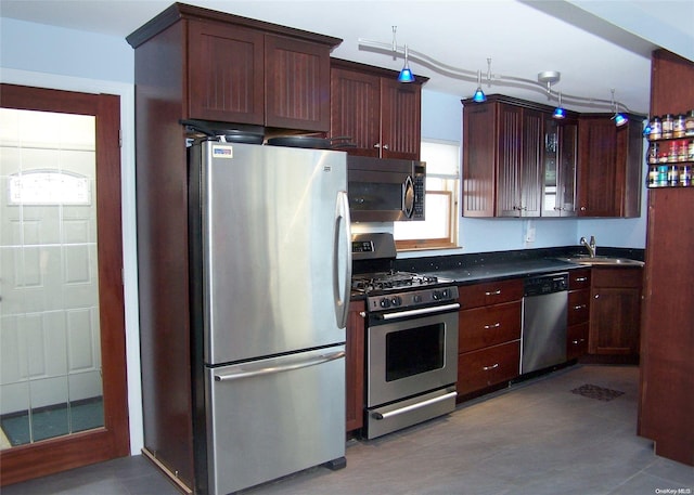 4 Quail Rd, Mastic Beach, NY 11951 - kitchen featuring stainless steel appliances, dark countertops, and glass insert cabinets