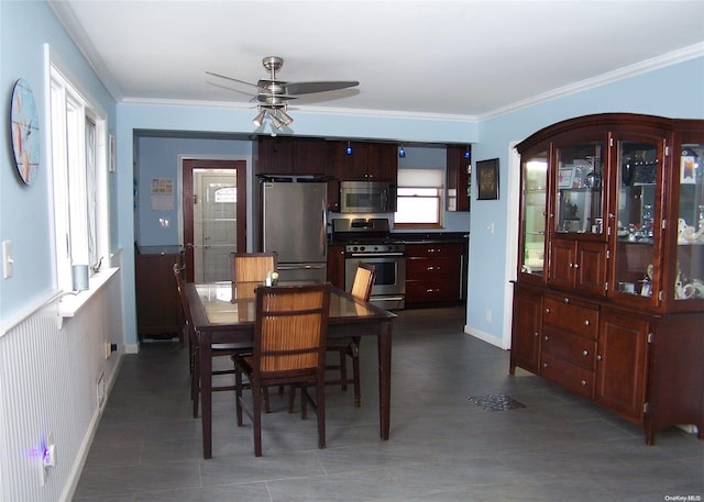 dining space featuring ceiling fan and ornamental molding