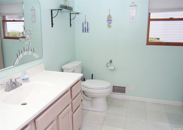 bathroom with tile patterned floors, vanity, and toilet