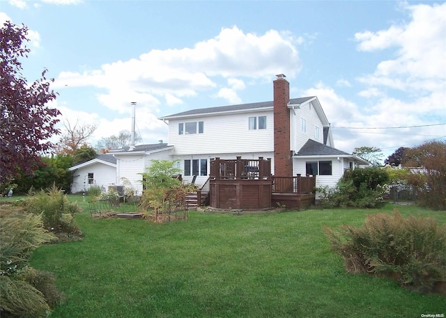 4 Quail Rd, Mastic Beach, NY 11951 - rear view of property with a wooden deck, a chimney, a lawn, and stairs