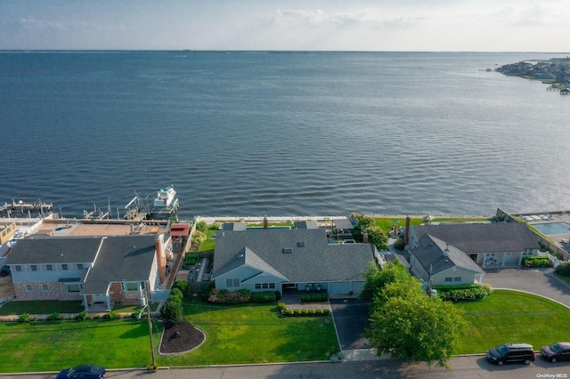 bird's eye view featuring a water view and a residential view