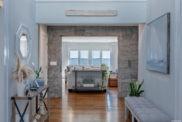 interior space featuring a water view and hardwood / wood-style flooring