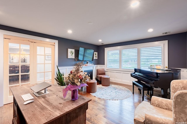 living room with light hardwood / wood-style flooring