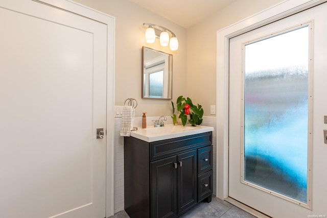 bathroom with tile patterned flooring and vanity