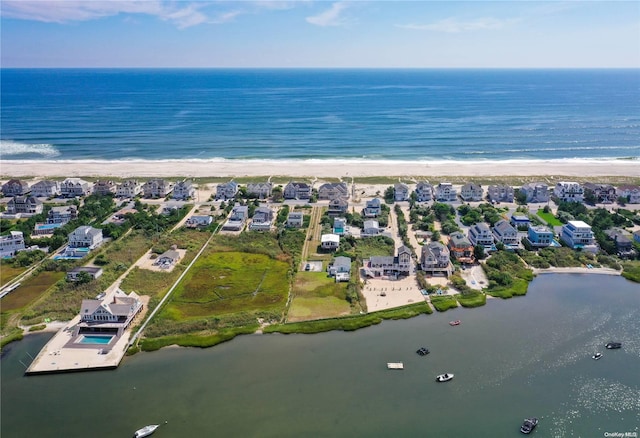 bird's eye view with a water view and a view of the beach