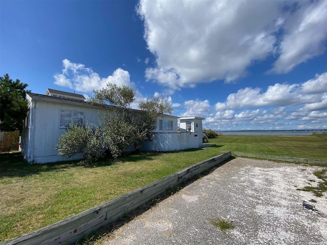 view of home's exterior featuring a lawn