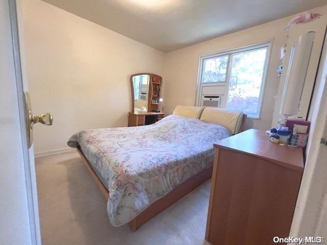 carpeted bedroom featuring cooling unit