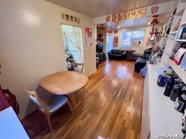 dining area with wood-type flooring