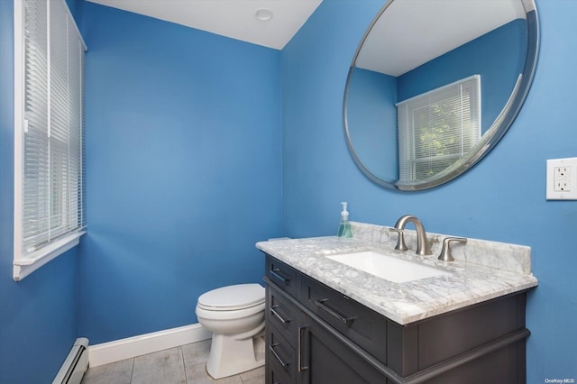 bathroom with baseboard heating, vanity, and toilet