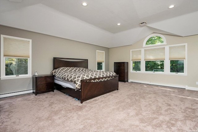 carpeted bedroom with lofted ceiling and a baseboard radiator