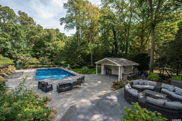 view of pool featuring a patio and an outdoor hangout area