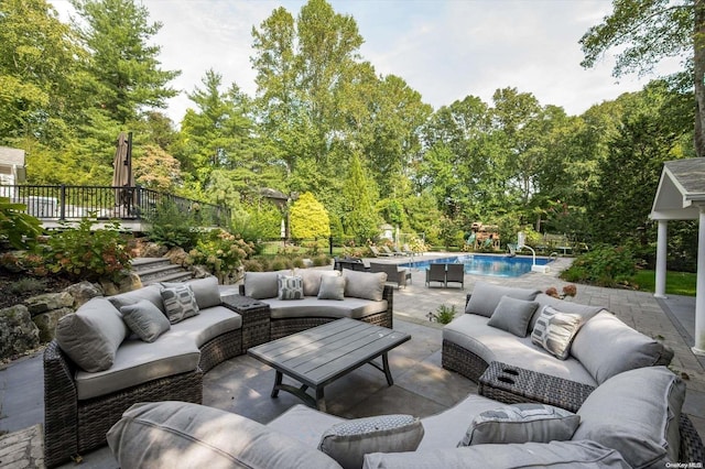 view of patio / terrace featuring a fenced in pool and outdoor lounge area