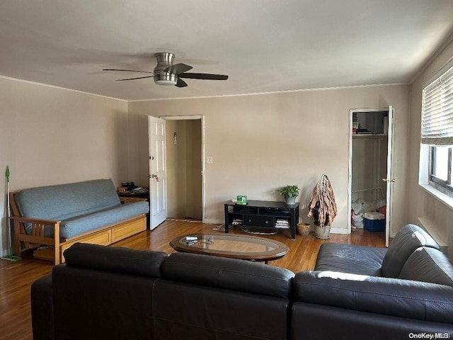 living room featuring ceiling fan and hardwood / wood-style floors