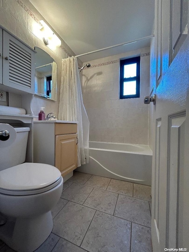 full bathroom featuring vanity, shower / tub combo, and toilet