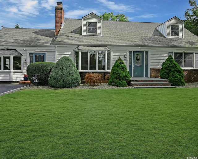 back of house featuring a yard