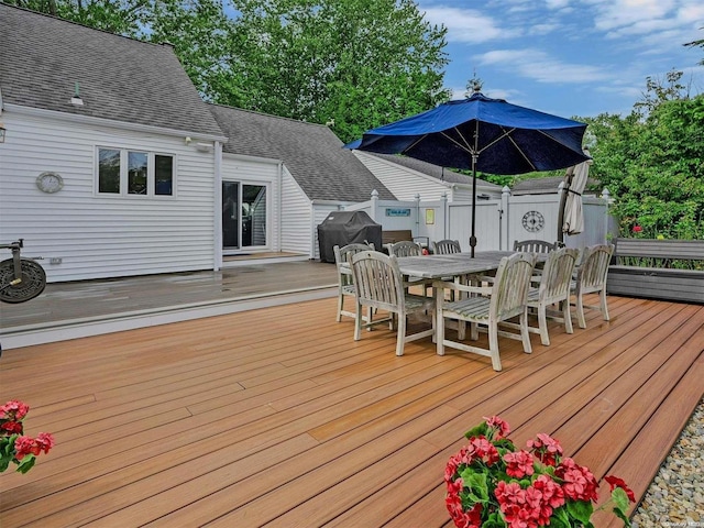 wooden deck with grilling area