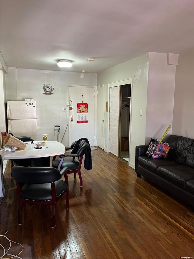 dining room with dark wood-type flooring