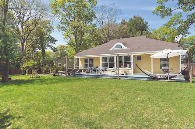 back of house with a yard and a patio area