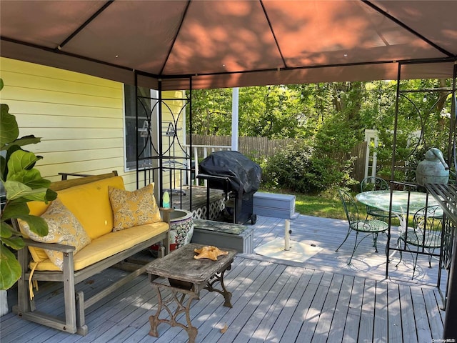 deck with a gazebo, grilling area, and an outdoor hangout area