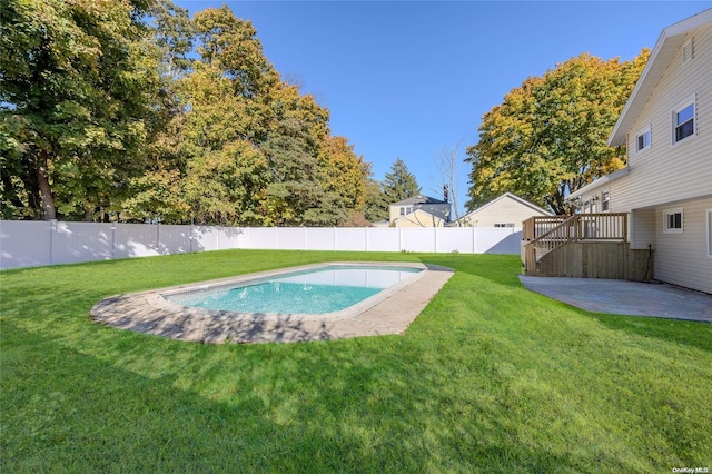 view of swimming pool with a patio area and a lawn