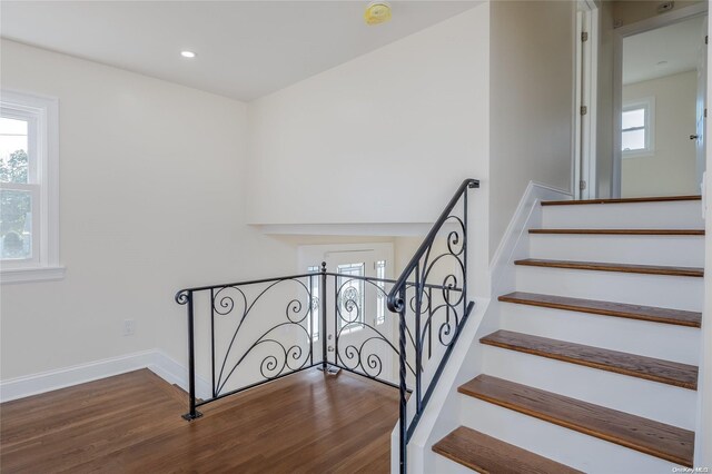 staircase featuring hardwood / wood-style floors