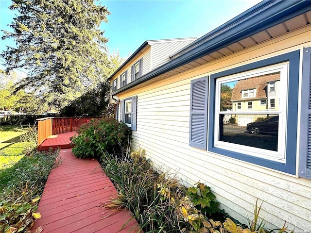 view of side of home featuring a deck