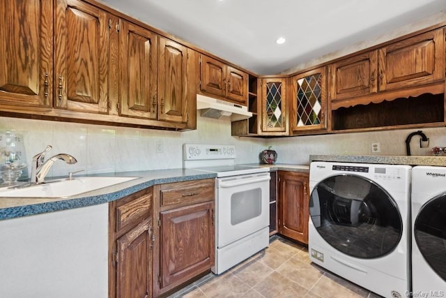 kitchen featuring independent washer and dryer, white electric range, and sink