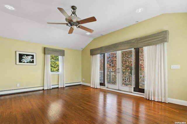 empty room featuring hardwood / wood-style flooring, ceiling fan, lofted ceiling, and a baseboard heating unit