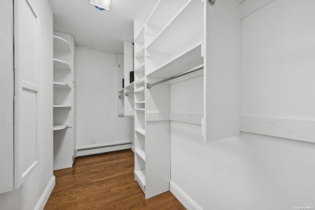 walk in closet featuring a baseboard radiator and dark hardwood / wood-style floors