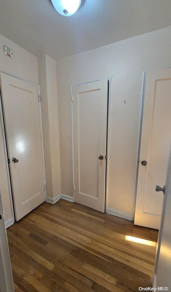 interior space with dark wood-type flooring