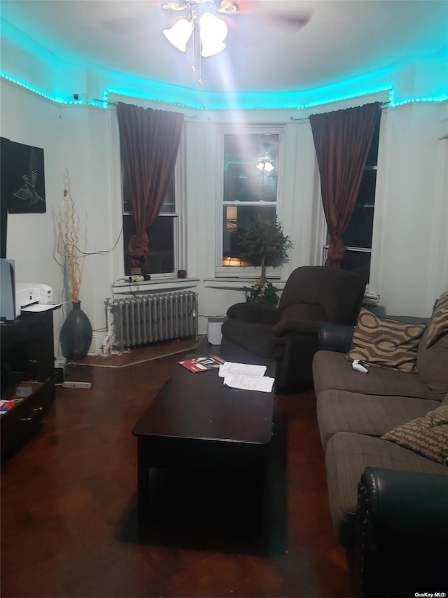 living room featuring radiator and ceiling fan