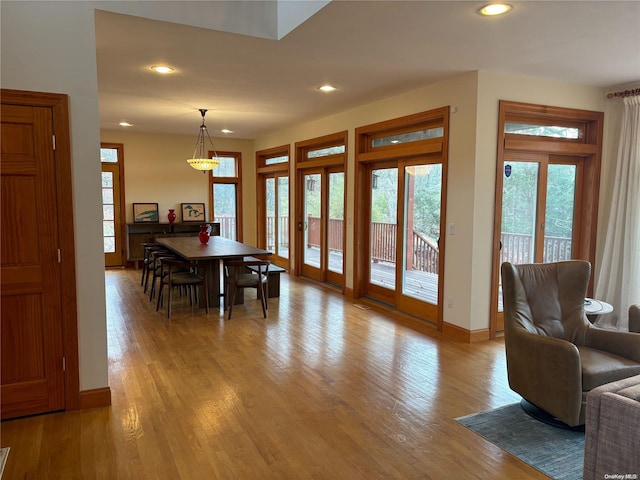 dining space featuring light wood-type flooring