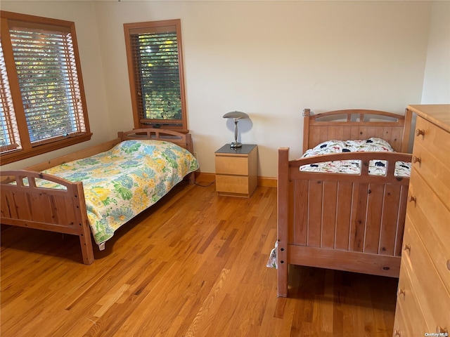 bedroom with light hardwood / wood-style floors