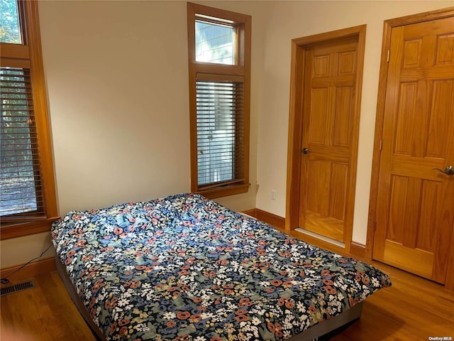 bedroom featuring hardwood / wood-style flooring