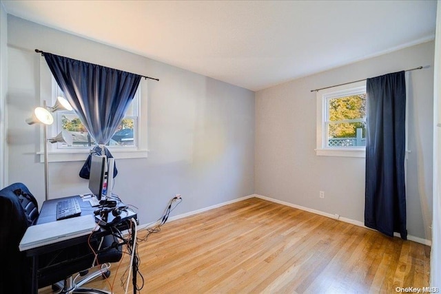 exercise room with hardwood / wood-style flooring