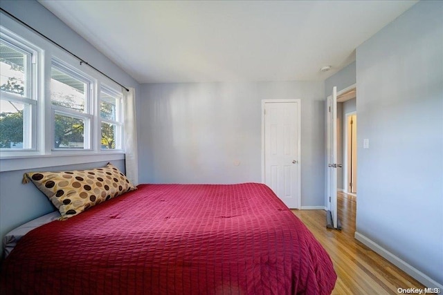 bedroom with light hardwood / wood-style flooring