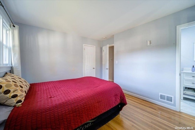 bedroom featuring hardwood / wood-style floors