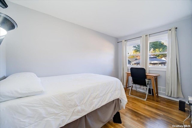 bedroom featuring hardwood / wood-style floors