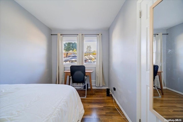 bedroom featuring dark hardwood / wood-style floors