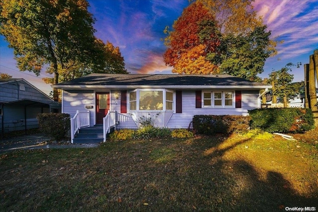 view of front of home featuring a yard