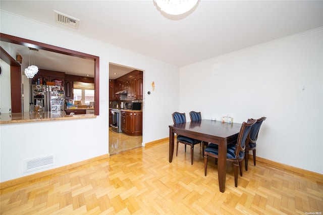 dining room with light parquet flooring