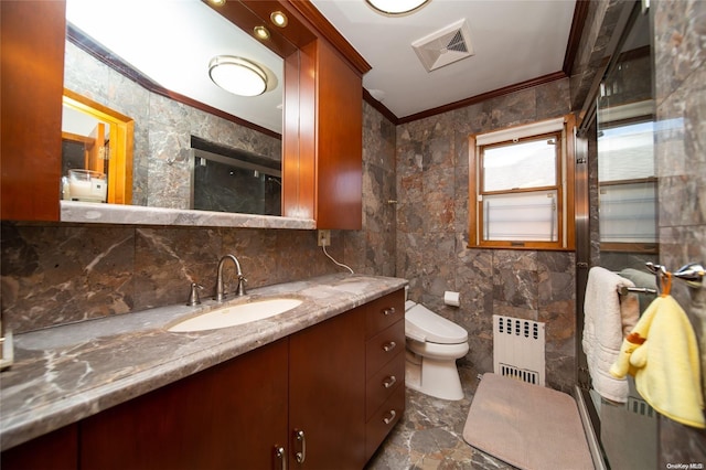 bathroom featuring radiator heating unit, vanity, toilet, and tile walls