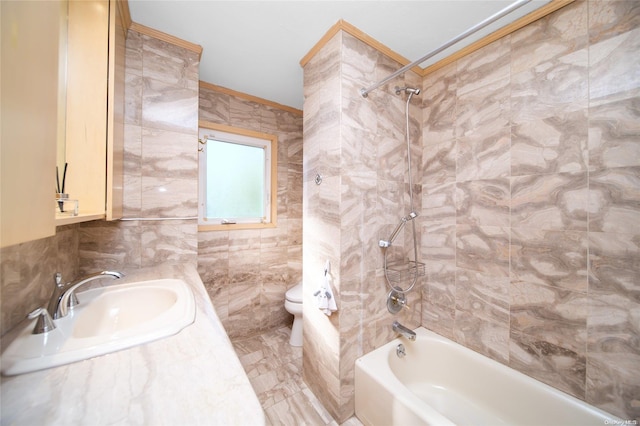 full bathroom featuring toilet, sink, tile walls, and tiled shower / bath combo