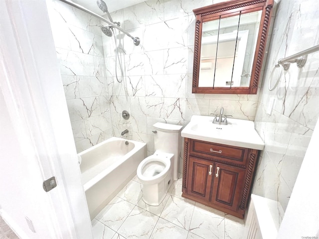 full bathroom with tiled shower / bath, tile walls, vanity, and toilet