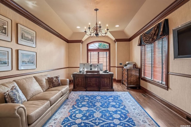 home office with hardwood / wood-style floors, a notable chandelier, and vaulted ceiling