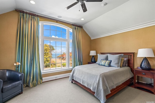 carpeted bedroom with ceiling fan and lofted ceiling