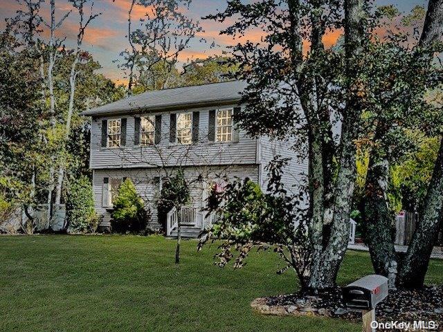 view of front of house with a yard