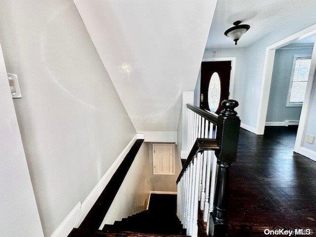 stairs with hardwood / wood-style floors