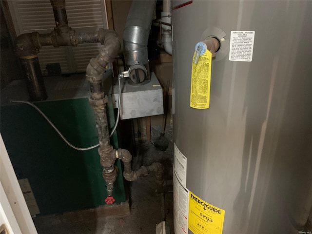 utility room featuring water heater