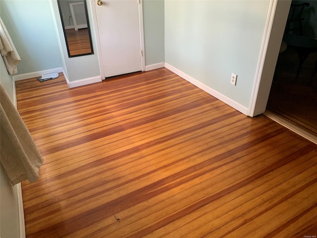 unfurnished bedroom with light hardwood / wood-style floors and a closet